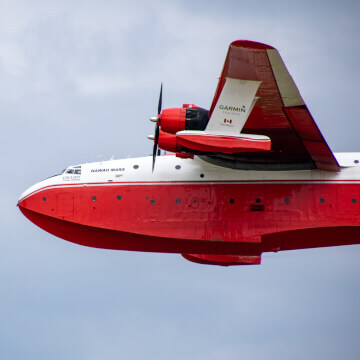 The Martin JRM Mars, can land on water and carry it.